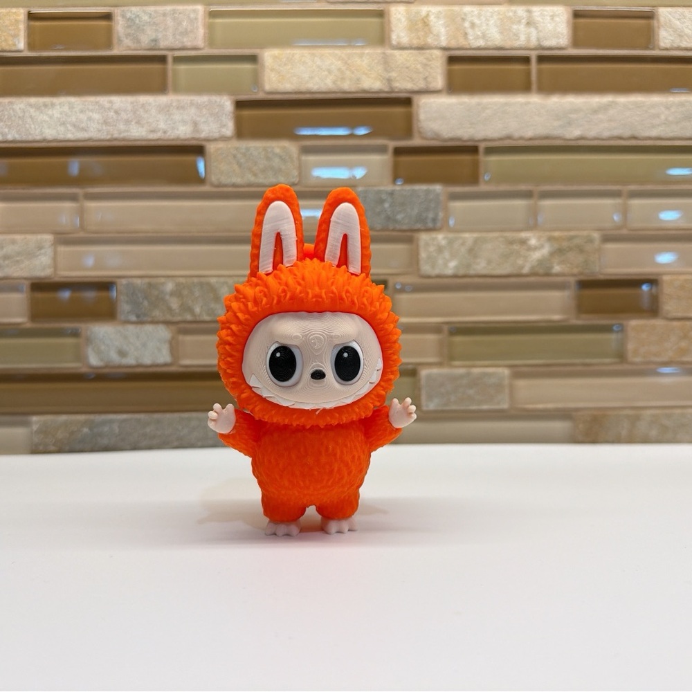3D-Printed Orange Labubu-Style Figure